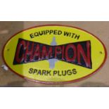 Cast iron Champion Spark Plugs sign, W: 24 cm. P&P Group 1 (£14+VAT for the first lot and £1+VAT for