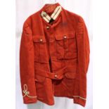 A 19th century British military tunic in red, some small areas of moth damage, and discolouration to