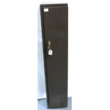 Four section steel shotgun or rifle cabinet, with four keys and a canvas rifle bag. Not available