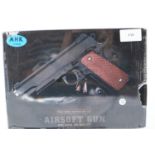New boxed 6mm airsoft BB pistol, model V13, in tan. P&P Group 2 (£18+VAT for the first lot and £3+