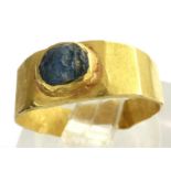 Medieval ring set with a blue stone, 2.0g. We estimate it to be a size F/G but it is misshapen. P&