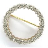 9ct gold diamond set halo brooch, D: 15 mm, 1.7g. P&P Group 1 (£14+VAT for the first lot and £1+