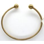 9ct gold torque bangle with detailing, 4.5g. P&P Group 1 (£14+VAT for the first lot and £1+VAT for