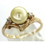 American 10ct gold pearl set ring with two diamonds, size Q/R, 2.6g. P&P Group 1 (£14+VAT for the
