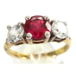 14ct gold trilogy ring set with a single ruby flanked by two white topaz stones, size U, 3.4g.