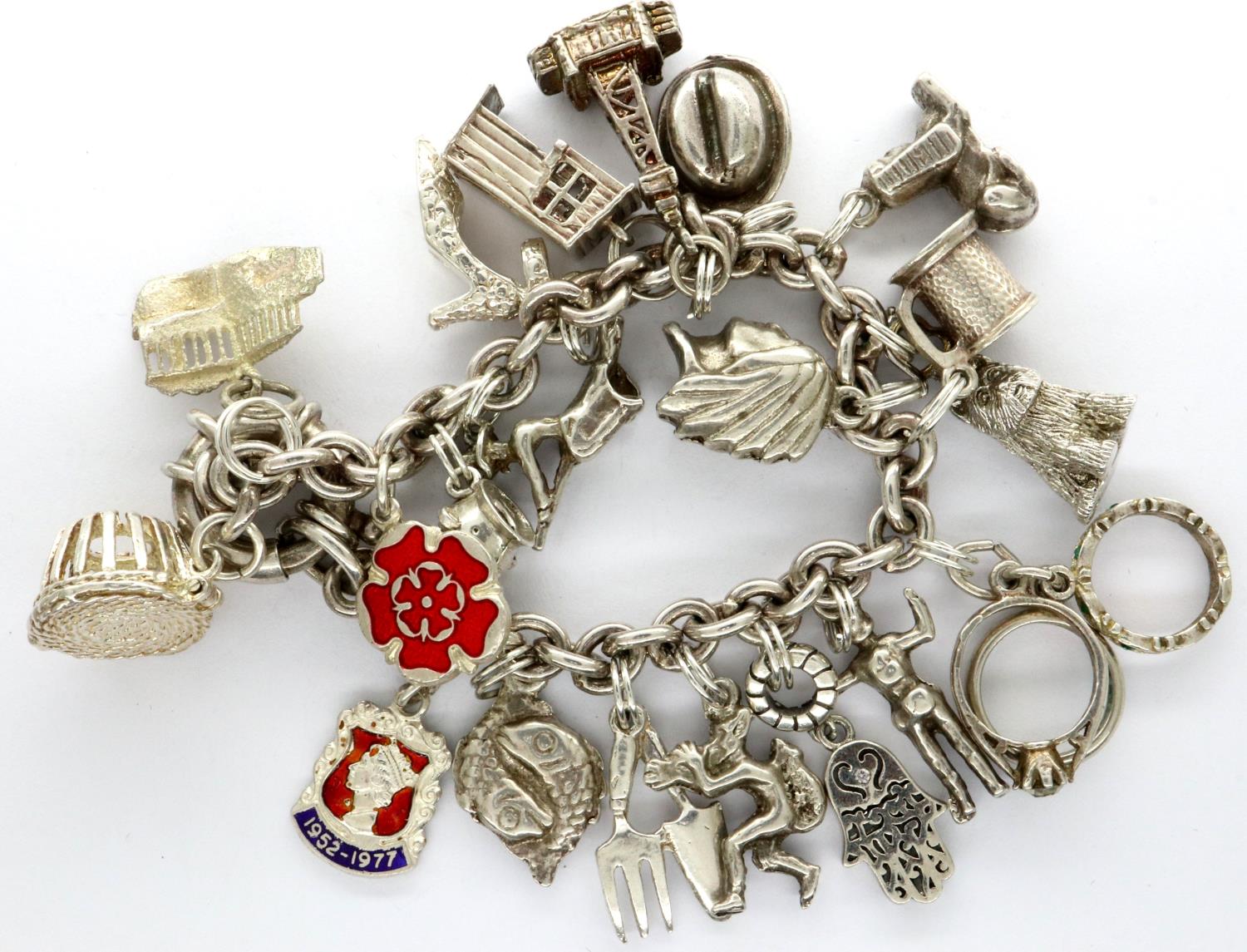 925 silver charm bracelet with twenty charms, L: 18 cm, combined 67g. P&P Group 1 (£14+VAT for the - Image 2 of 3