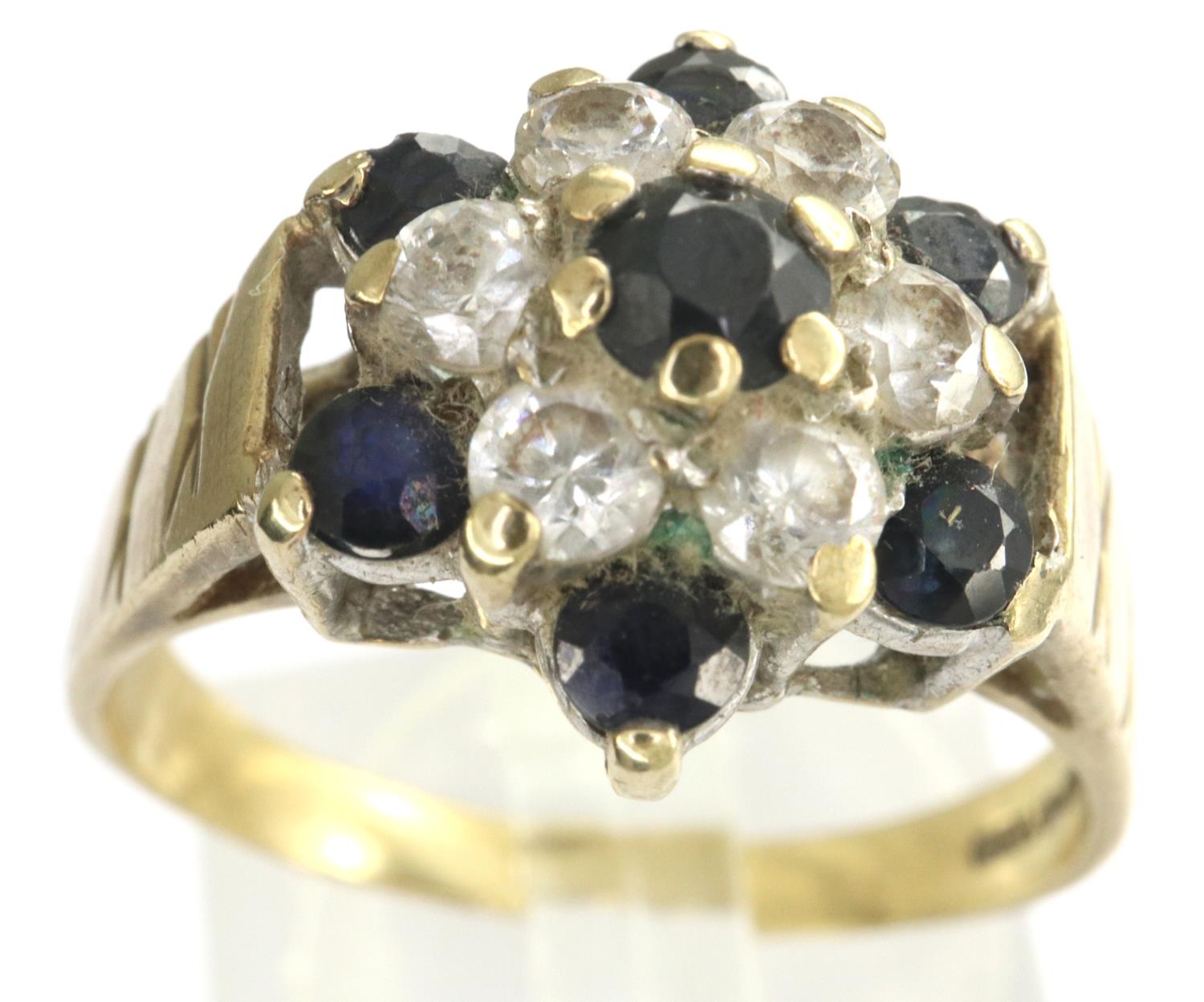 9ct gold flower ring set with sapphires and CZ, size R, 3.6g. P&P Group 1 (£14+VAT for the first lot