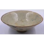 A celadon glazed porcelain bowl having incised decoration to its interior and a footed base, D: 12