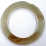 Carved jade bangle, chip to edge. Internal D: 48 mm, external D: 67 mm. P&P Group 1 (£14+VAT for the
