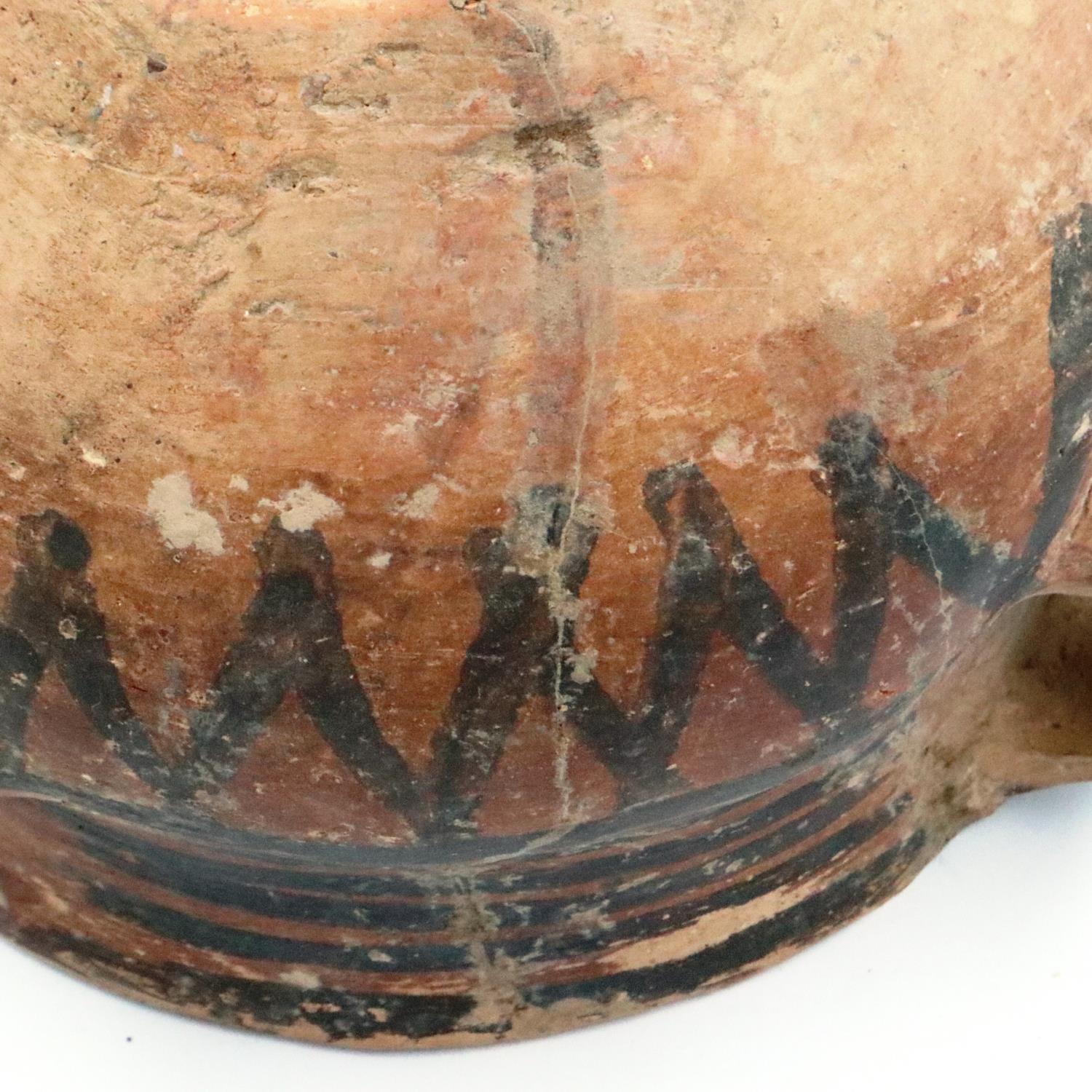 A Neolithic period painted terracotta twin handled pot, decorated with geometric designs, repaired - Image 8 of 9