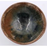 A southern Song Dynasty glazed bowl, footed, D: 10 cm, H: 4 cm. P&P Group 2 (£18+VAT for the first