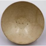 A Jin or Yuan Dynasty large porcelain bowl, decorated in relief with raised lines, D: 19 cm, H: 6