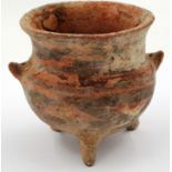 A Neolithic period terracotta cauldron of diminutive proportions, raised on three supports and
