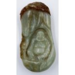 A pale celadon and brown jade carved seated buddha within a naturalistic surround, 10 x 5 cm. P&P