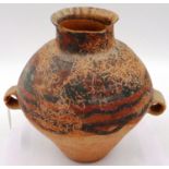 A Neolithic period vessel, the body tapered with two ring handles, retaining much of its original
