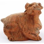 A Ming Dynasty zoomorphic terracotta ram ornament, hollow formed with incised detail, L: 12 cm, H: