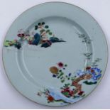 An 18th century ceramic plate painted with floral design with pagoda and river, D: 23 cm. Hairline