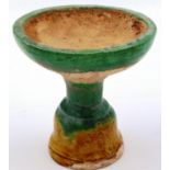 A Ming Dynasty glazed white clay pedestal, having a bowl form top supported on a shaped stand, D: 11