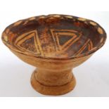 A Neolithic period footed bowl, interior decorated with geometric triangular designs, D: 16 cm, H: