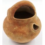 A Han Dynasty terracotta vessel, with short spout having straining holes and integral handle, D: