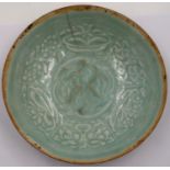 A rare Jin Dynasty celadon bowl, the interior decorated in relief with sprays of flowers and a