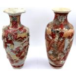 Two similar Japanese 19th century glazed stoneware vases, each decorated with figures, one having