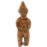 Han Dynasty grey pottery figure of a standing man with crossed arms, H: 23 cm. Loss to tip of