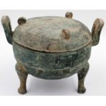 An archaic Shang Dynasty ritual bronze food vessel and cover, finely decorated by engraving