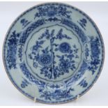 An 18th century porcelain plate with floral decoration in blue against a white ground, D: 23 cm.