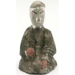 A Han Dynasty grey clay kneeling guardian, retaining most of its features and some of its original