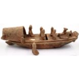 A rare Eastern Han Dynasty pottery boat, having six seated figures (one detached but present) and
