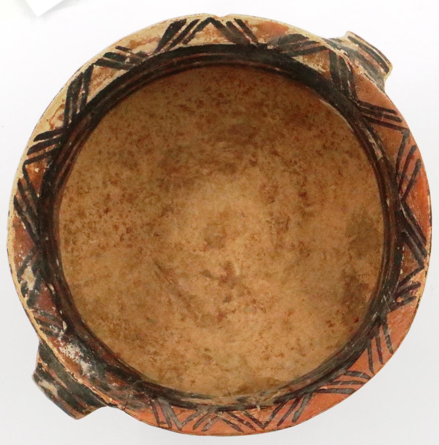A Neolithic period painted terracotta twin handled pot, decorated with geometric designs, repaired - Image 5 of 9