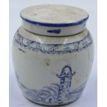 An early 19th century covered jar, decorated in blue with designs of pagodas, overall H: 10 cm. P&