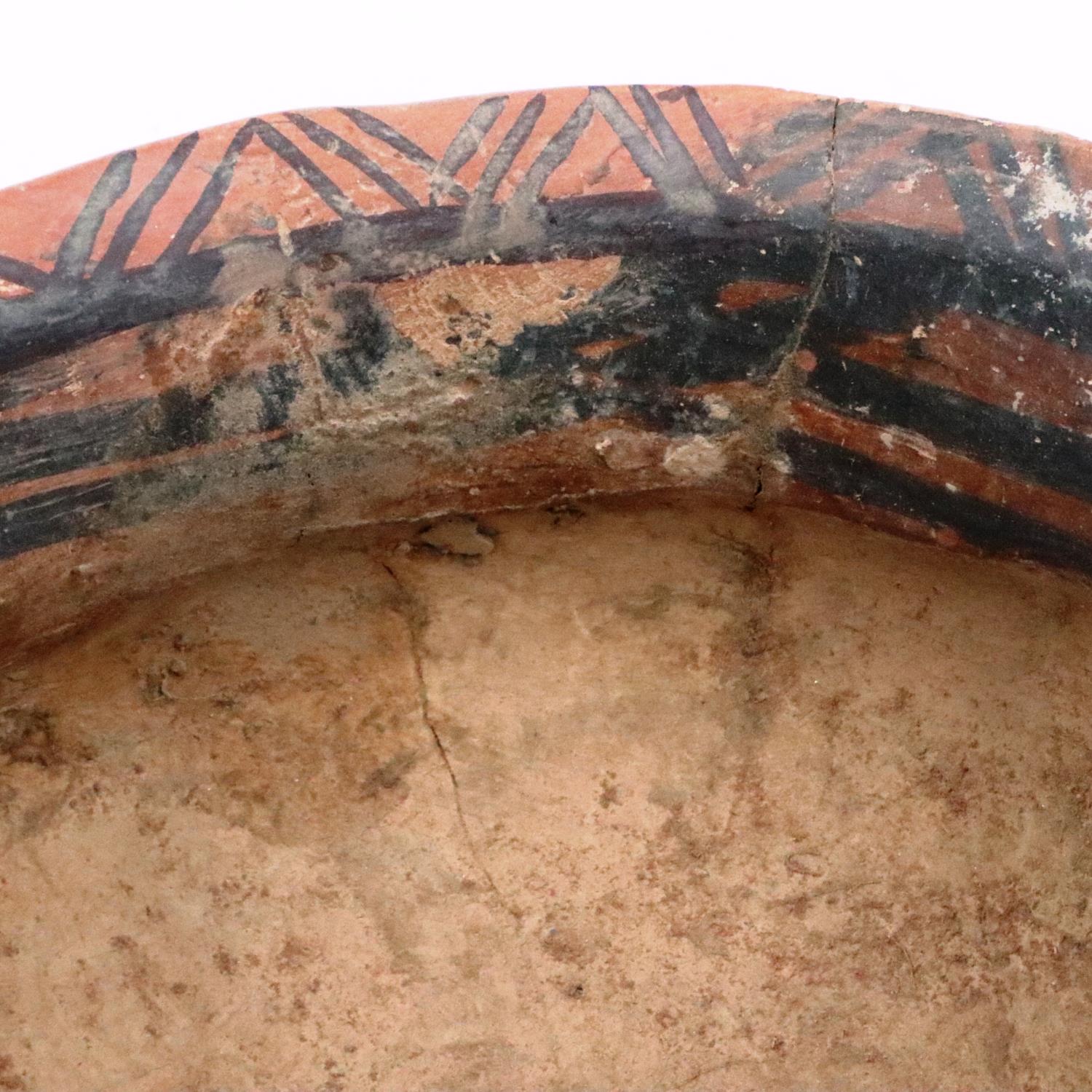A Neolithic period painted terracotta twin handled pot, decorated with geometric designs, repaired - Image 9 of 9