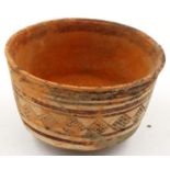 An Indus Valley Neolithic period bowl, footed, D: 10 cm, H: 7 cm. Repaired damage to the body.