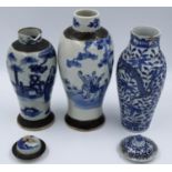 Three blue-over white decorated jars, two with covers, comprising a Kangxi-marked jar decorated with