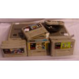 Two Super Nintendo entertainment systems, twelve games to include Super Mario Kart, one