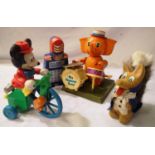 Vintage plastic toys including drumming elephant and cycling Mickey Mouse, both clockwork. Plus a