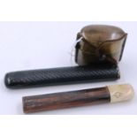 A Japanese Meiji period bronze single-case inro with a lacquered bamboo and polished bone pipe case,