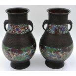 A pair of Japanese Meiji period champleve enamelled bronze vases, footed and of bulbous form, each