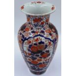 A Japanese Meiji period baluster vase decorated with colours from the Imari palette and detailed