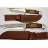 Two hunting knives by Jack Pyke, each with walnut grips and leather sheathes. P&P Group 3 (£25+VAT