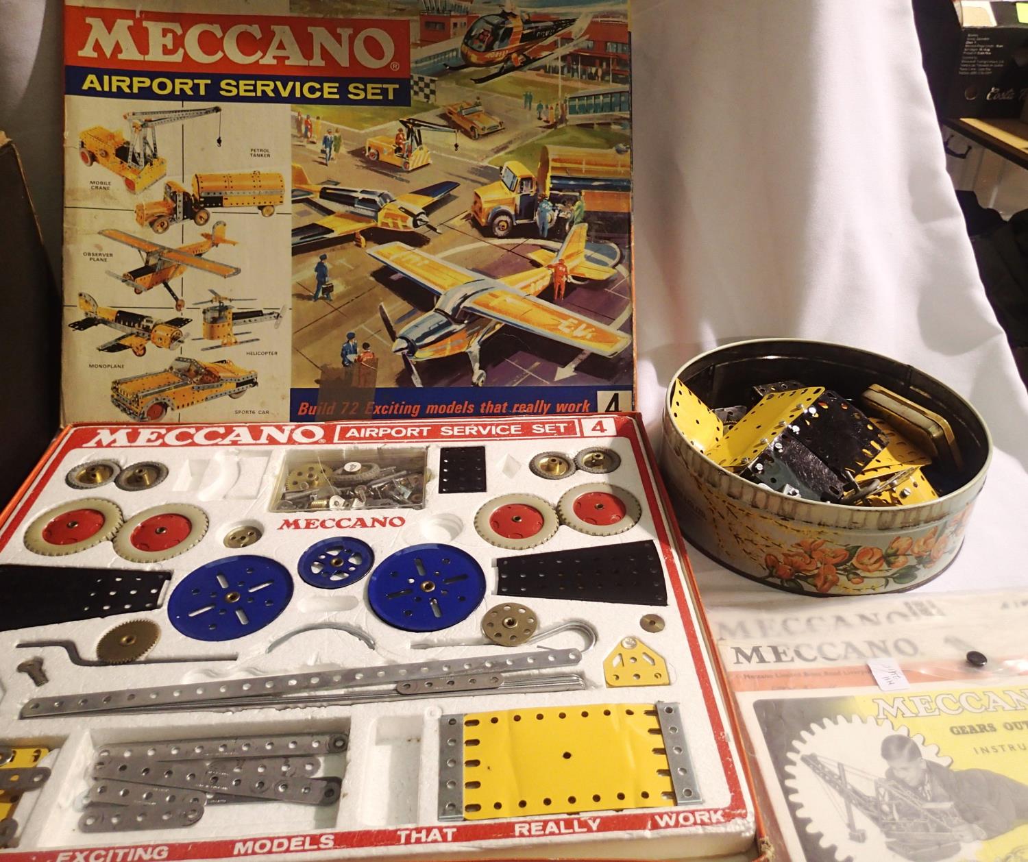 Meccano airport services set, contents very good, few parts missing, box is fair. Plus build