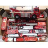 Approximately twenty five fire engines, plastic and metal, various makes and scales, in mostly