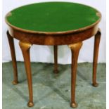 An early 20th century walnut demi-lune games table with fold over top and cabriole supports, D: 84