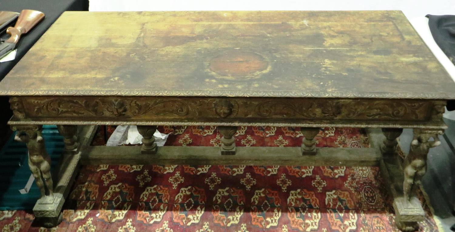 A Victorian oak centre table, carved in the Jacobean manner, with figural and bulbous supports,