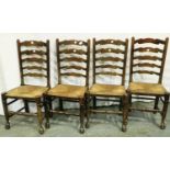 Four ladder back country oak kitchen chairs with rushed seats and ball feet. Not available for in-