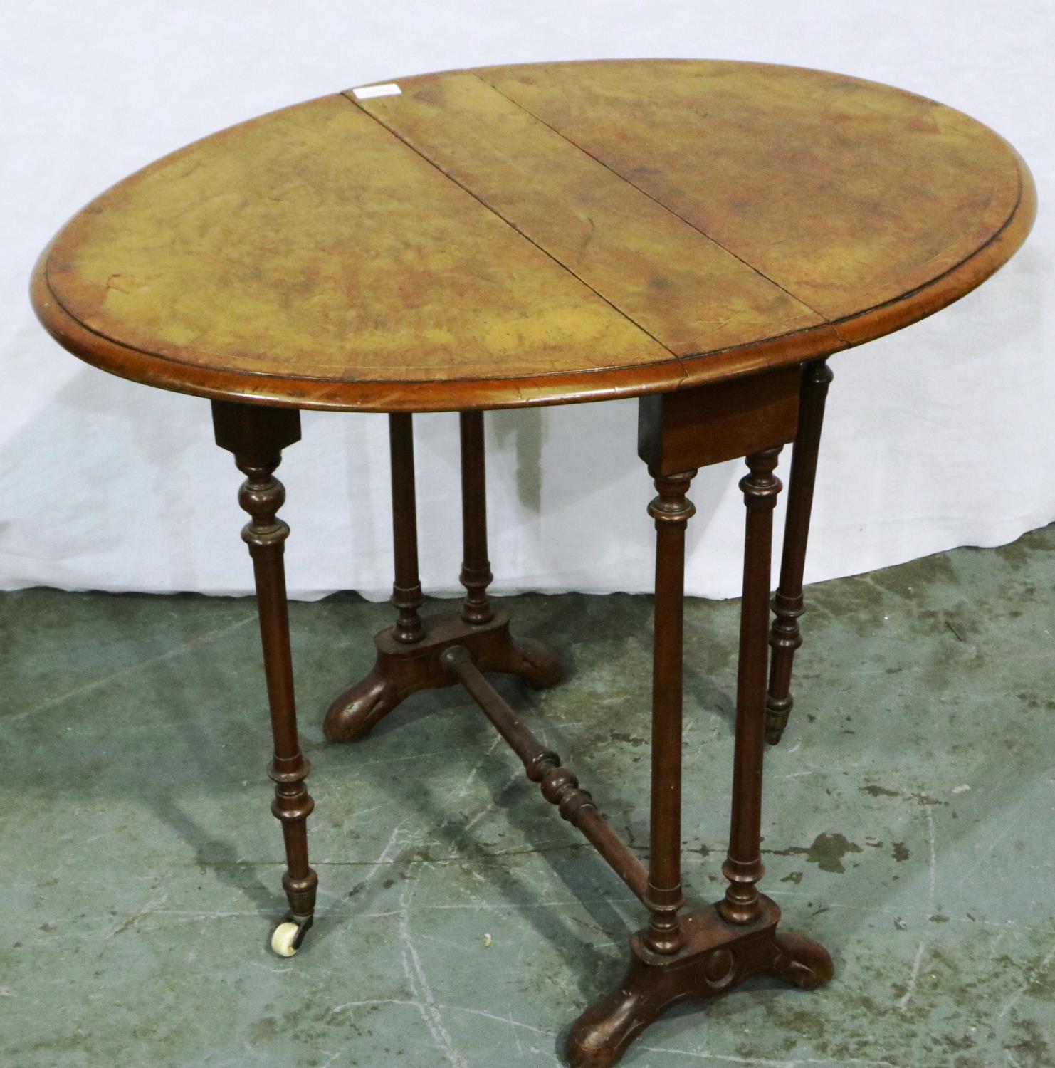 A Victorian burr walnut inlaid Sutherland table with carved and turned supports, 82 x 61 x 64 cm