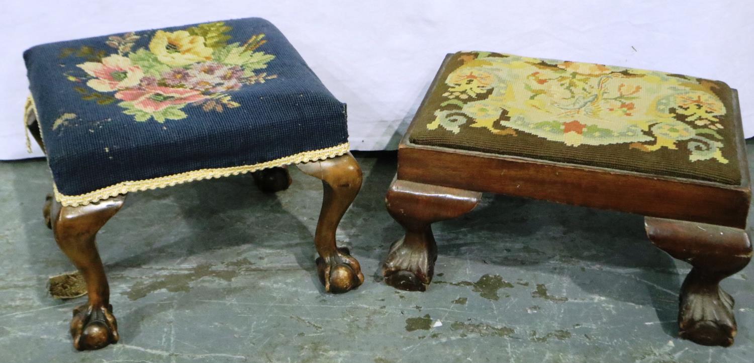 Two 19th century walnut and mahogany framed stools, each with wool work pads and claw and ball