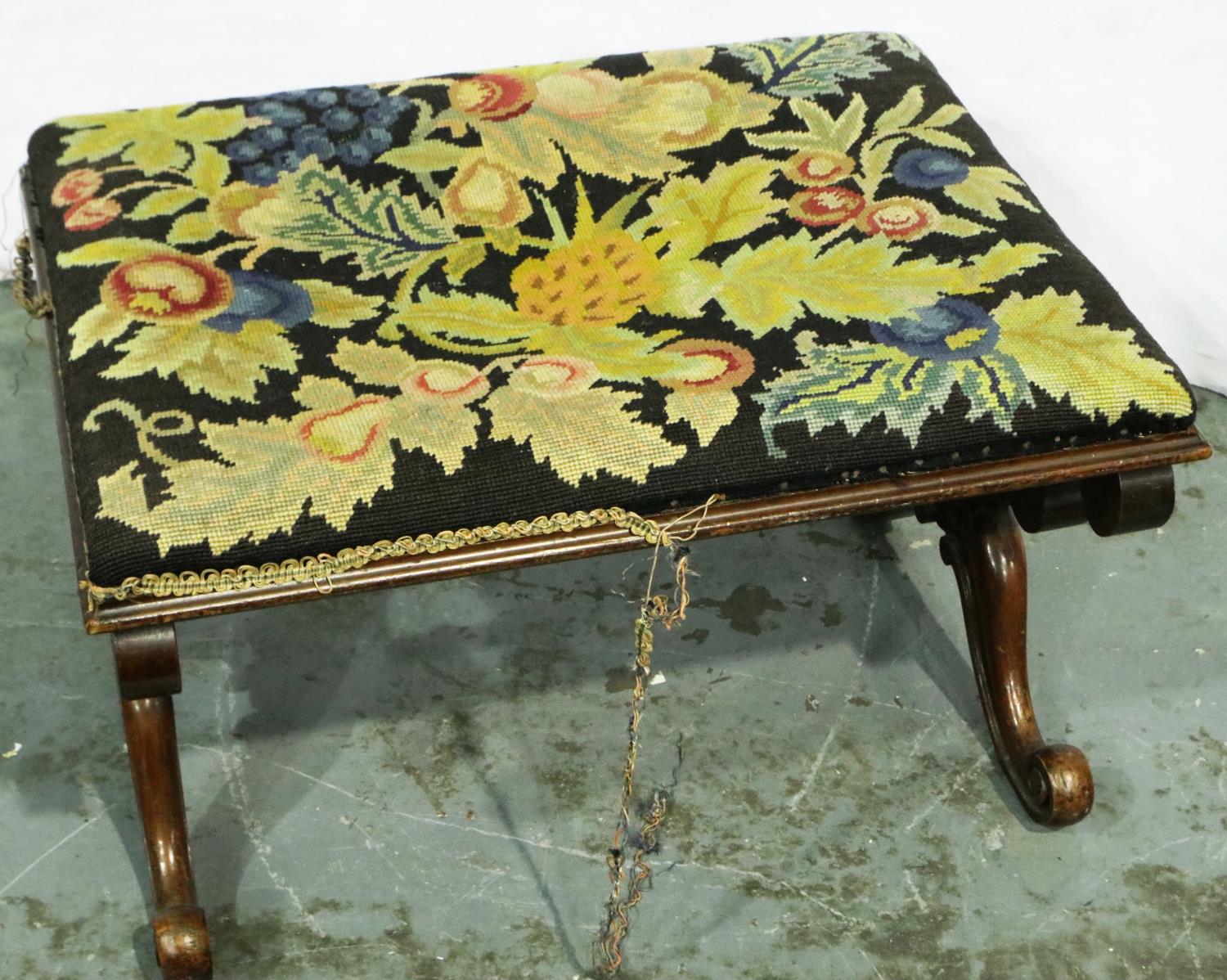 A Victorian walnut framed stool with Savoronola form supports and wool work upholstered top, 65 x 48